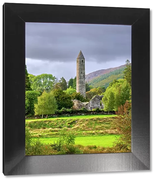 The Round Tower at sunset, Early Medieval Monastic Settlement, Glendalough, County Wicklow, Ireland