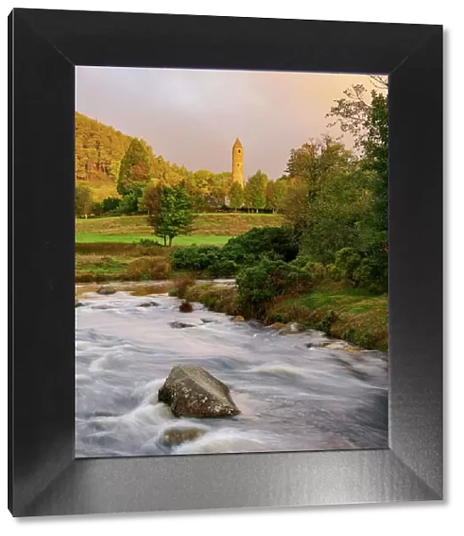 View over Glendasan River towards The Round Tower at sunrise, Early Medieval Monastic Settlement, Glendalough, County Wicklow, Ireland
