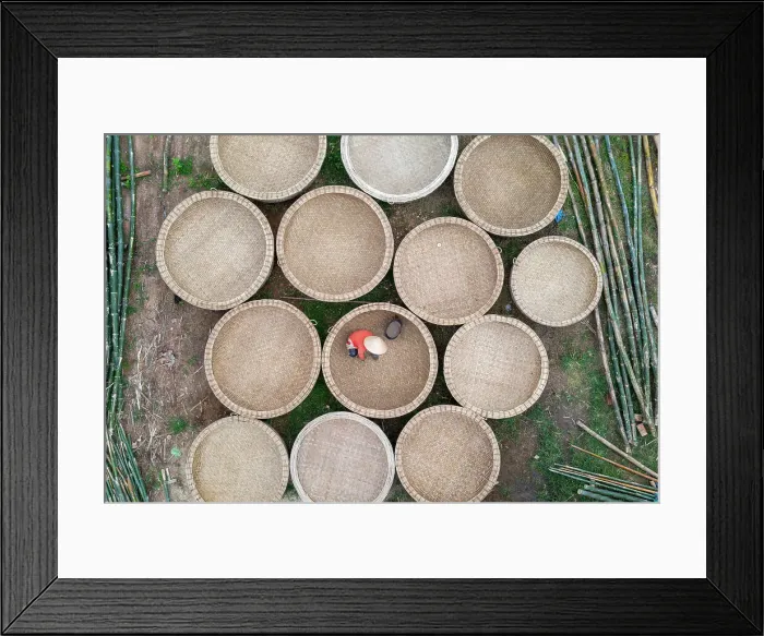 Framed Print : Vietnam, Phu Yen Province, a woman works in a basket boat factory Framed Print : Vietnam, Phu Yen Province, a woman works in a basket boat factory