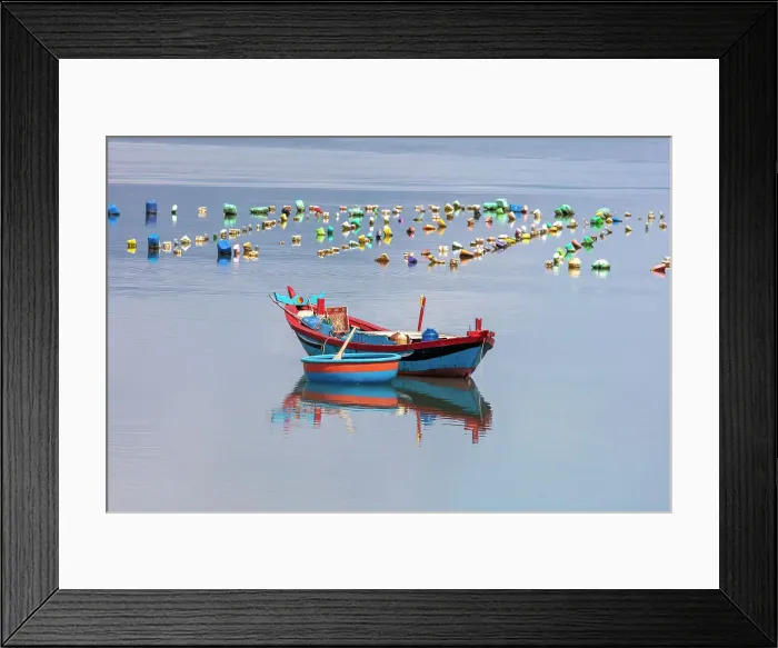 Framed Print : Vietnam, Phu Yen, a blue fishing boat and basket boat Framed Print : Vietnam, Phu Yen, a blue fishing boat and basket boat