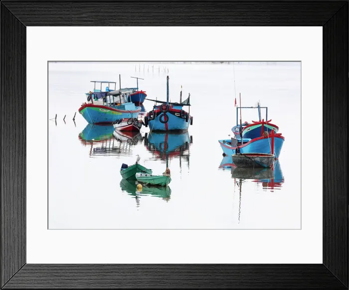 Framed Print : Vietnam, Cam Ranh, an egret sits among fishing boats reflected in calm water Framed Print : Vietnam, Cam Ranh, an egret sits among fishing boats reflected in calm water