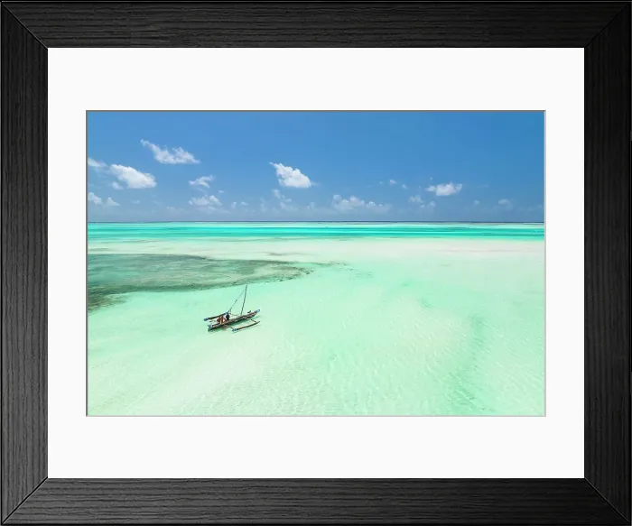 Framed Print : a Dhow plows through the sea of the lagoon, Zanzibar, Tanzania Framed Print : a Dhow plows through the sea of the lagoon, Zanzibar, Tanzania