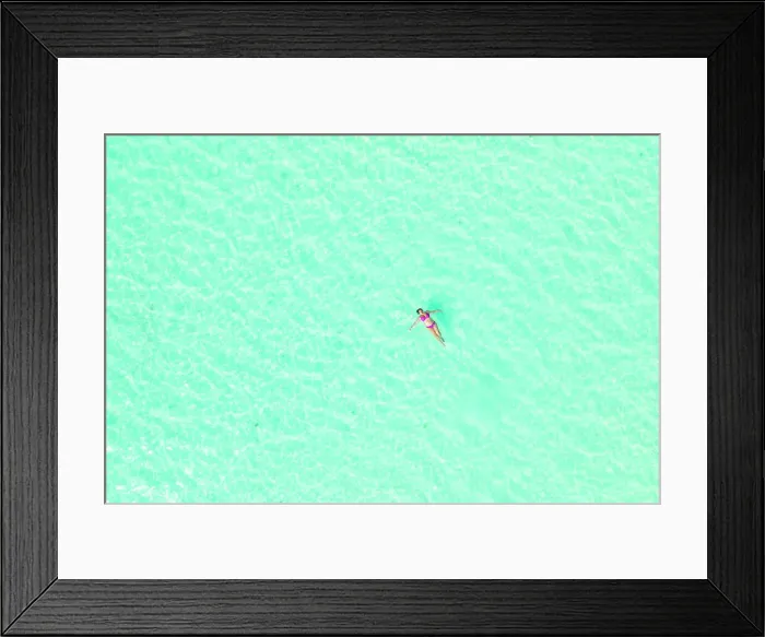 Framed Print : a girl relaxes by taking a bath in the turquoise waters of the sea, Zanzibar, Tanzania Framed Print : a girl relaxes by taking a bath in the turquoise waters of the sea, Zanzibar, Tanzania