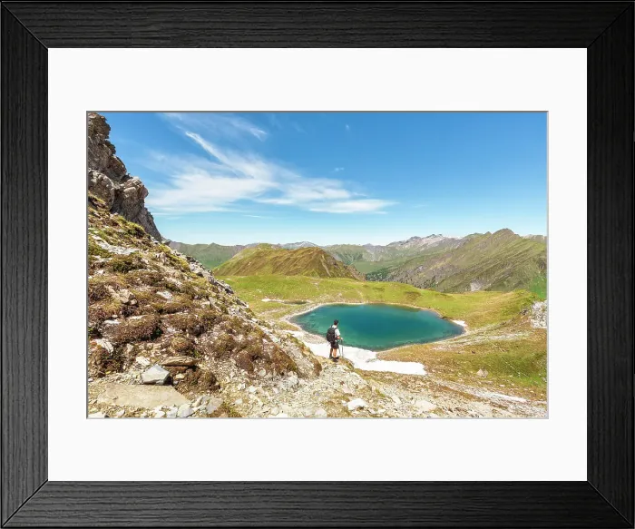 Framed Print : A mountaineer admiring Lake Ramsgrubner and the Tux alps on a summer day, Wildlahner, Schmirn Valley, Innsbruck Land, Tyrol, Austria