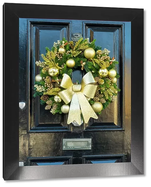Christmas wreath on a door in Kensington, London, England, UK
