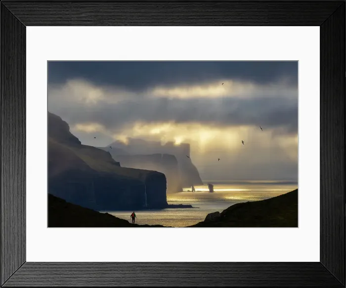 Framed Print : A trekker observes the scenic view in front of him from Kallur Lighthouse at sunset, Kalsoy, Faroe Islands, Denmark (MR) Framed Print : A trekker observes the scenic view in front of him from Kallur Lighthouse at sunset, Kalsoy, Faroe Islands, Denmark (MR)