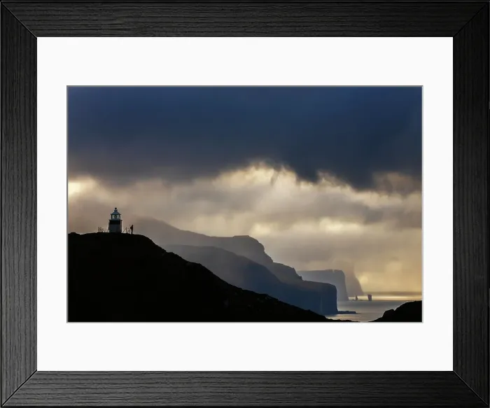 Framed Print : A trekker at Kallur lighthouse with a scenic view at sunset, Kalsoy, Faroe Islands, Denmark Framed Print : A trekker at Kallur lighthouse with a scenic view at sunset, Kalsoy, Faroe Islands, Denmark