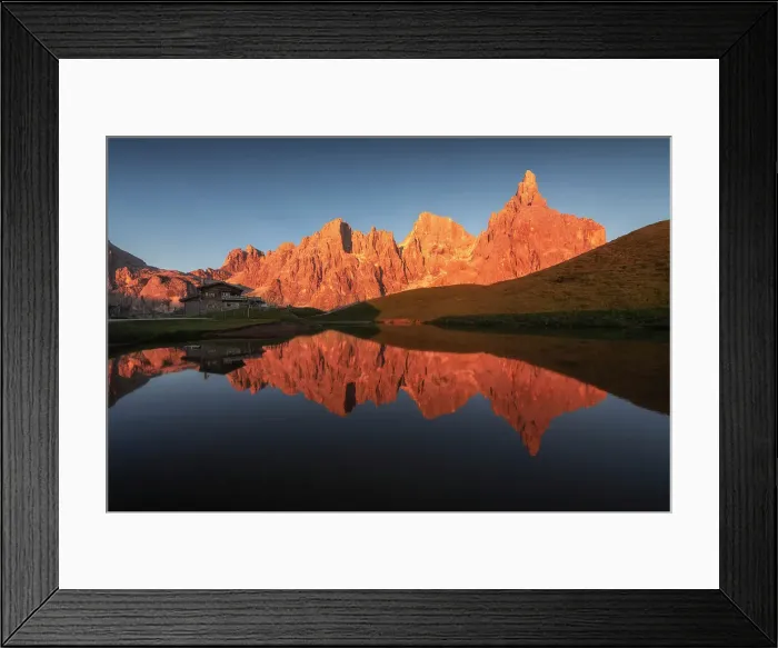 Framed Print : The Pale di San Martino lit up at sunset during a summer evening, reflecting in the pond of the Baita Segantini. Dolomites, Italy