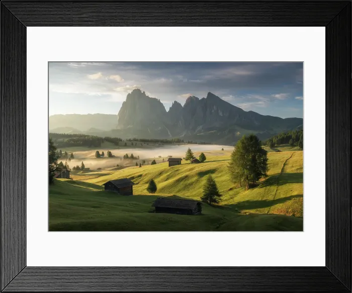 Framed Print : A foggy sunrise, Alpe di Siusi (Seiser Alm), with the Sassolungo and Sassopiatto and wooden cabins. Dolomites, Italy Framed Print : A foggy sunrise, Alpe di Siusi (Seiser Alm), with the Sassolungo and Sassopiatto and wooden cabins. Dolomites, Italy