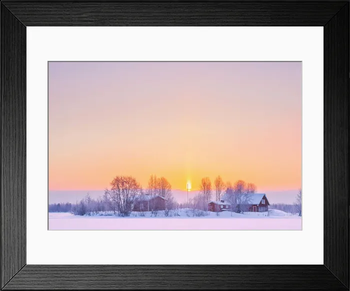 Framed Print : Europe, Finland, a group of traditional red buidlings on a little island in a frozen lake near Rovaniemi after a snow fall with the sun sun rising in the background Framed Print : Europe, Finland, a group of traditional red buidlings on a little island in a frozen lake near Rovaniemi after a snow fall with the sun sun rising in the background