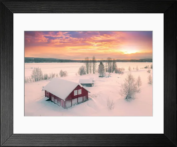 Framed Print : Europe, Finland, Rovaniemi, aerial view of a frozen lake near Rovaniemi with traditional red buildings with the sun rising on a winter morning Framed Print : Europe, Finland, Rovaniemi, aerial view of a frozen lake near Rovaniemi with traditional red buildings with the sun rising on a winter morning