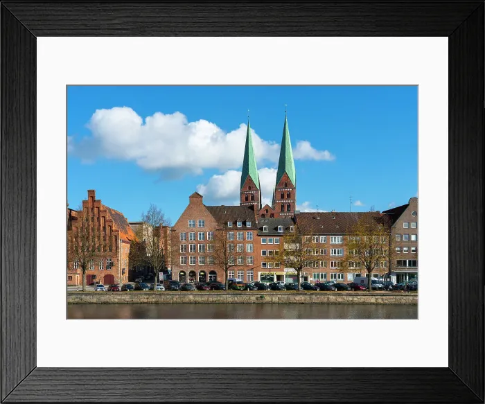 Framed Print : Houses on riverfront of Trave river with towers of St. Marienkirche church in background, Lubeck, UNESCO, Schleswig-Holstein, Germany Framed Print : Houses on riverfront of Trave river with towers of St. Marienkirche church in background, Lubeck, UNESCO, Schleswig-Holstein, Germany