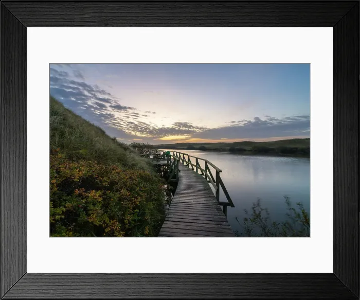 Framed Print : Wooden boardwalk leading by Nehrungsee lake at dawn, Wittdun, UNESCO, Amrum island, Nordfriesland, Schleswig-Holstein, Germany Framed Print : Wooden boardwalk leading by Nehrungsee lake at dawn, Wittdun, UNESCO, Amrum island, Nordfriesland, Schleswig-Holstein, Germany