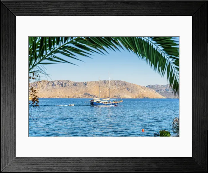 Framed Print : A sailing boat in Symi, Dodecanese Islands, Greece Framed Print : A sailing boat in Symi, Dodecanese Islands, Greece