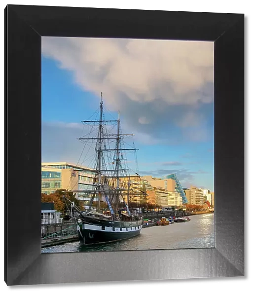 View over River Liffey towards The Jeanie Johnston Coffin Ship at sunset, Dublin, Ireland