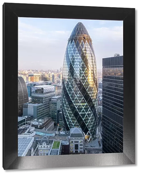 Europe, UK, England, London, City of London financial district. Elevated view of skyscrapers in the city centre with the Gherkin (30 St. Mary Axe, Norman Foster & Partners, 2004)