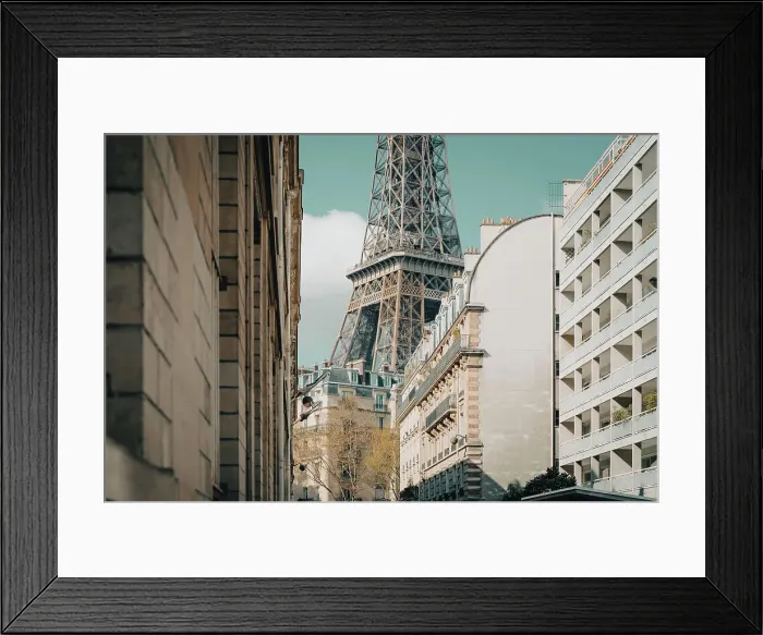 Framed Print : Section of the Eiffel Tower seen from the streets of Paris, France Framed Print : Section of the Eiffel Tower seen from the streets of Paris, France