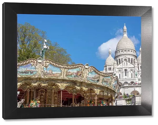 Sacre Coeur, Montmartre, Paris, France. Carousel in foreground