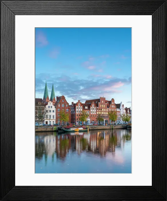 Framed Print : Houses on riverfront of Trave river with towers of St. Marienkirche church in background at sunset, Lubeck, UNESCO, Schleswig-Holstein, Germany Framed Print : Houses on riverfront of Trave river with towers of St. Marienkirche church in background at sunset, Lubeck, UNESCO, Schleswig-Holstein, Germany