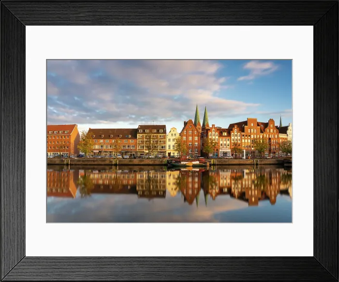 Framed Print : Houses on riverfront of Trave river with towers of St. Marienkirche church in background at sunset, Lubeck, UNESCO, Schleswig-Holstein, Germany Framed Print : Houses on riverfront of Trave river with towers of St. Marienkirche church in background at sunset, Lubeck, UNESCO, Schleswig-Holstein, Germany