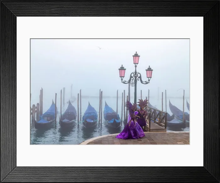 Framed Print : Italy, Veneto, Venice, a couple pose in costume during the Venice Carnival on a foggy day Framed Print : Italy, Veneto, Venice, a couple pose in costume during the Venice Carnival on a foggy day