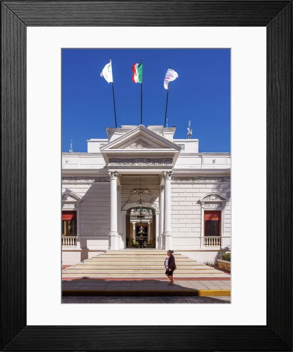 Framed Print : Mayan lady passes in front of a classic colonial building in Merida, Yucatan, Mexico Framed Print : Mayan lady passes in front of a classic colonial building in Merida, Yucatan, Mexico