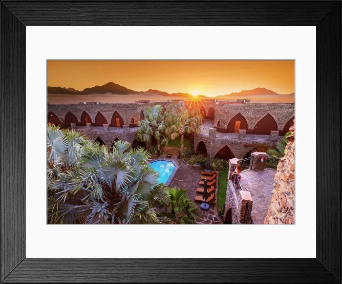 Framed Print : Namibia, a tourist watching the sunset in a luxury hotel in the Namib Naukluft National Park with the sun setting on the Namib desert dunes MR Framed Print : Namibia, a tourist watching the sunset in a luxury hotel in the Namib Naukluft National Park with the sun setting on the Namib desert dunes MR