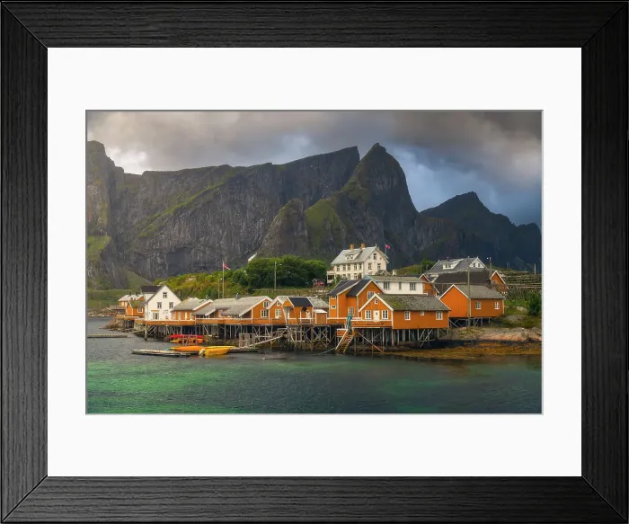 Framed Print : The rorbuer of Sakrisoy, a small village in the souther part of the Lofoten Islands, during a stormy summer afternoon. Norway