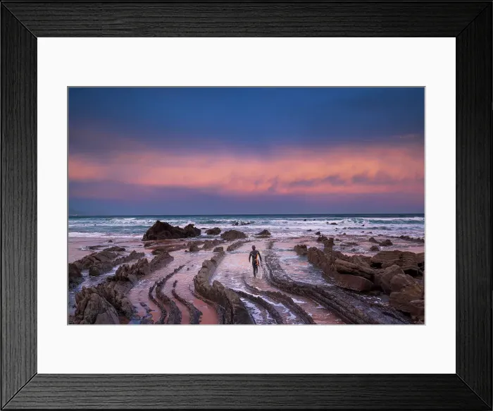 Framed Print : Spain, Basque country, a surfer walking towards the sea at a rock beach near Bilbao at sunrise Framed Print : Spain, Basque country, a surfer walking towards the sea at a rock beach near Bilbao at sunrise