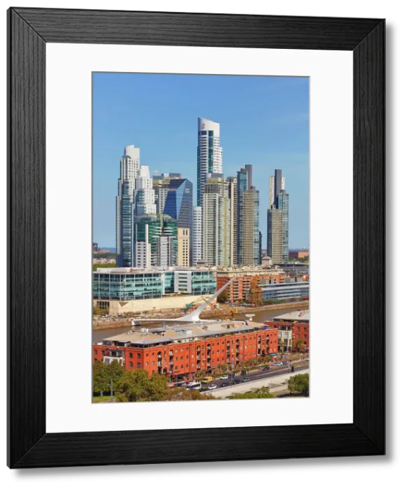 Framed Print : The Puente de la Mujer bridge with the skyscrapers of Puerto Madero in the background, Buenos Aires, Argentina Framed Print : The Puente de la Mujer bridge with the skyscrapers of Puerto Madero in the background, Buenos Aires, Argentina