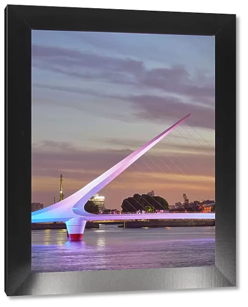The 'Puente de la Mujer' bridge with a special illumination at twilight, Puerto Madero, Buenos Aires, Argentina