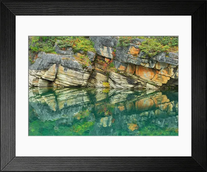 Framed Print : Reflection of shoreline rocks in Horseshoe Lake, Jasper National Park, Alberta, Canada