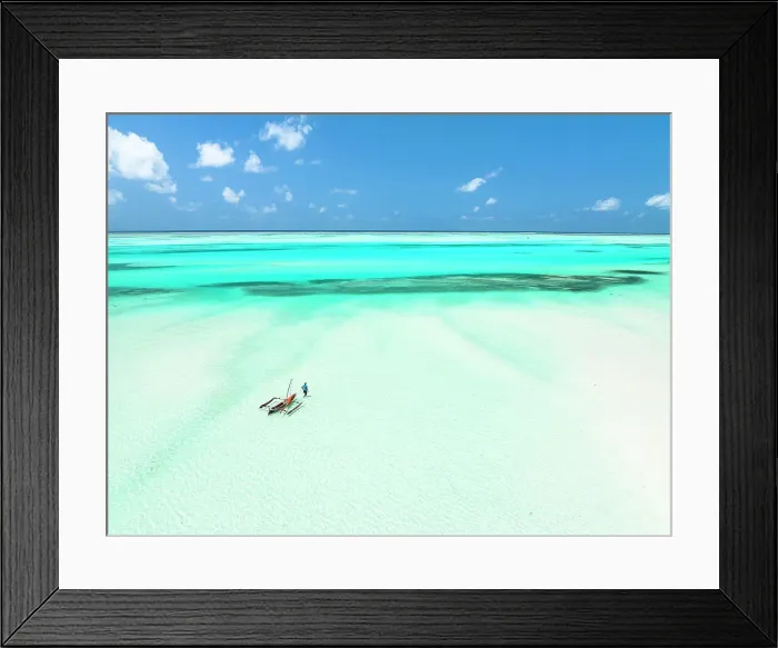 Framed Print : Lone fisherman with dhow approaching to the sea, Paje, Jambiani, Zanzibar, Tanzania Framed Print : Lone fisherman with dhow approaching to the sea, Paje, Jambiani, Zanzibar, Tanzania