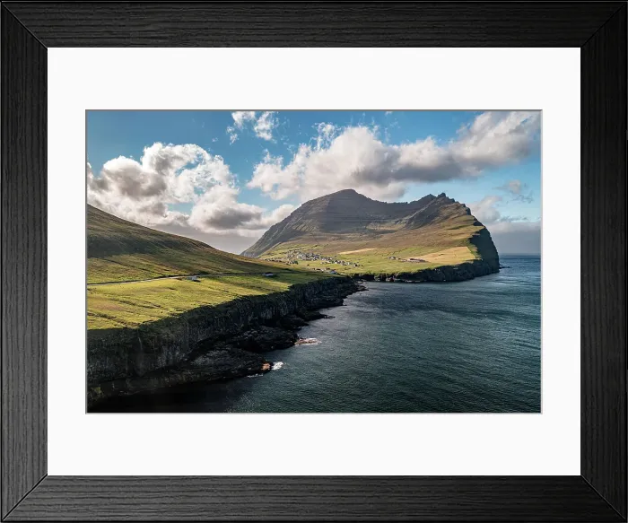 Framed Print : Aerial view of cliffs with Vidareidi village on background, Vidoy Island, Faroe Islands Framed Print : Aerial view of cliffs with Vidareidi village on background, Vidoy Island, Faroe Islands