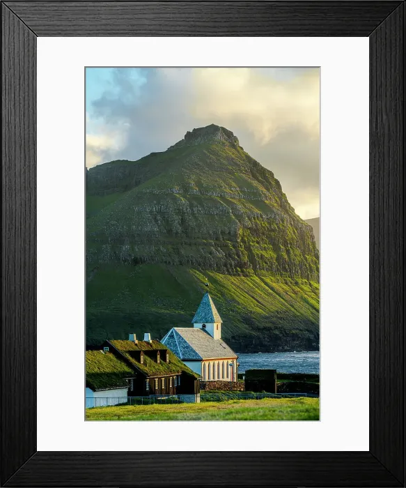Framed Print : Vidareidi church and grass roof houses framed by majestic mountains of Bordoy island, Vidoy Island, Faroe Islands Framed Print : Vidareidi church and grass roof houses framed by majestic mountains of Bordoy island, Vidoy Island, Faroe Islands