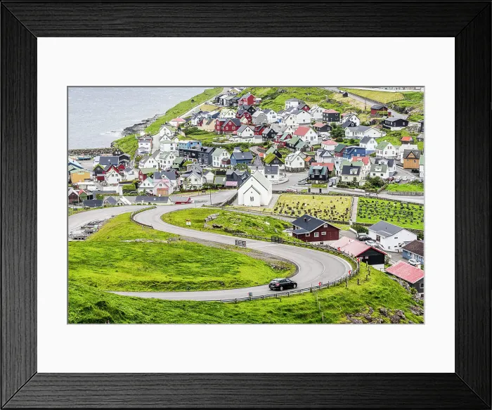 Framed Print : High angle view of car driving on winding road to the iconic Eidi village, Eysturoy Island, Faroe Islands Framed Print : High angle view of car driving on winding road to the iconic Eidi village, Eysturoy Island, Faroe Islands