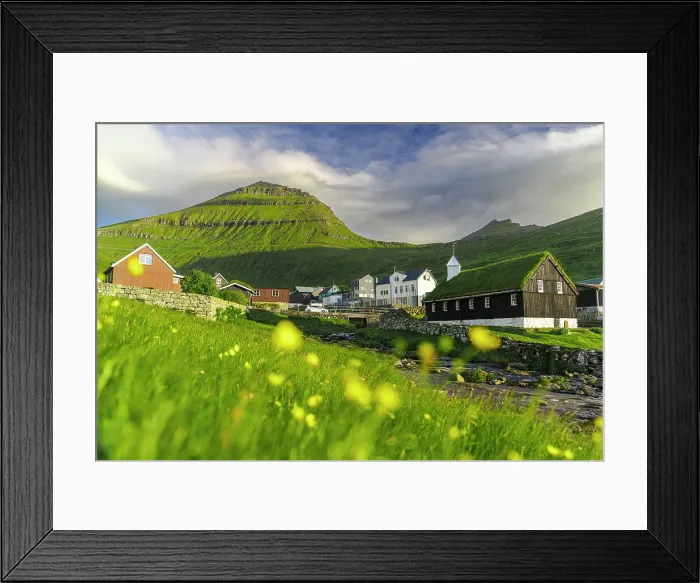 Framed Print : Funningur church and village surrounding by flowering meadows in summer, Eysturoy Island, Faroe Islands Framed Print : Funningur church and village surrounding by flowering meadows in summer, Eysturoy Island, Faroe Islands