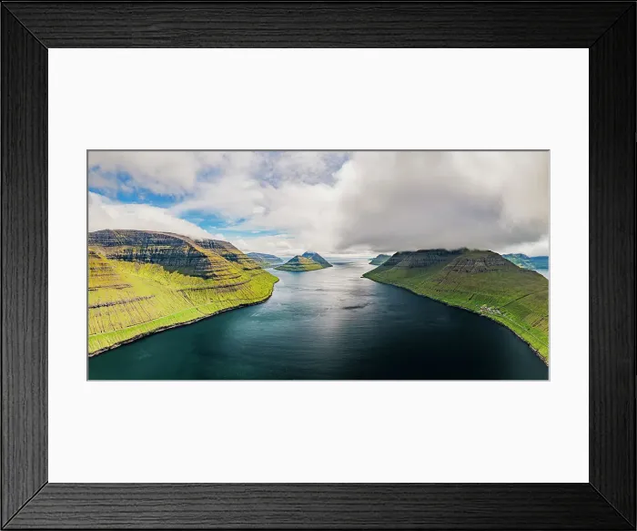 Framed Print : Cloudy sky over the blue Atlantic Ocean and cliffs of Kunoy and Kalsoy islands, aerial view, Faroe Island, Denmark Framed Print : Cloudy sky over the blue Atlantic Ocean and cliffs of Kunoy and Kalsoy islands, aerial view, Faroe Island, Denmark