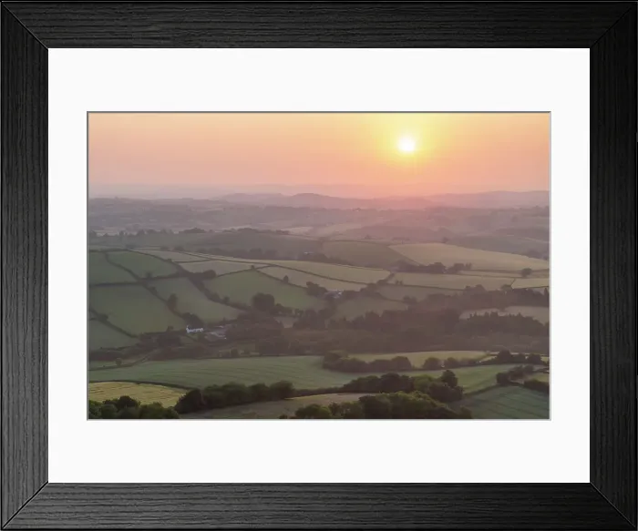 Framed Print : Summer sunrise over the rolling countryside of Dartmoor, Devon, England. Summer (June) 2023