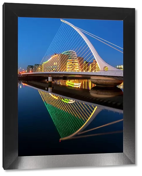 Ireland, Dublin, River Liffey, Samuel Beckett Bridge and convention centre at dusk