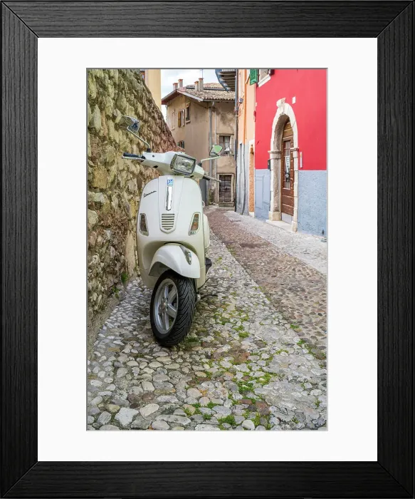 Framed Print : Piaggio Vespa scooter parked in a cobbled street of Malcesine, Lake Garda, Veneto, Italy Framed Print : Piaggio Vespa scooter parked in a cobbled street of Malcesine, Lake Garda, Veneto, Italy