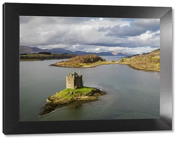 Aerial view of Castle Stalker on a tidal islet in Loch Laich, Port Appin, Argyll, Scotland. Spring (March) 2023