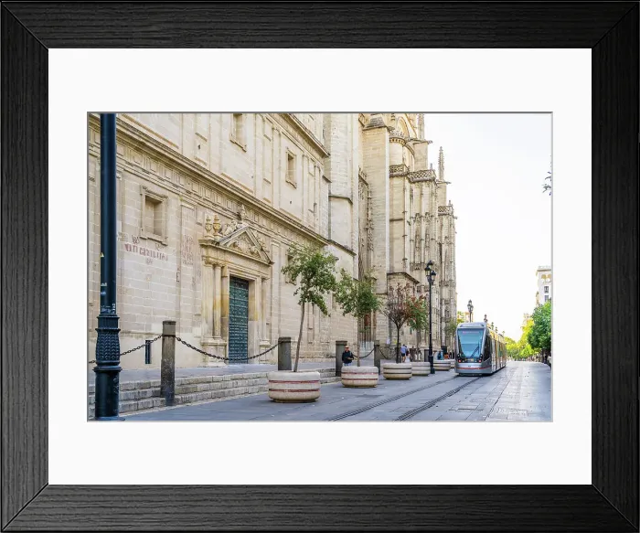 Framed Print : Tram passing outside Seville Cathedral, Seville, Andalusia, Spain Framed Print : Tram passing outside Seville Cathedral, Seville, Andalusia, Spain