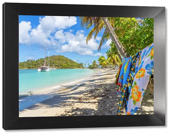 Sarongs for sale on Salt Whistle bay Beach, Mayreau Island in the Tobago Cays in the Grenadines Islands, Saint Vincent and the Grenadines, Caribbean