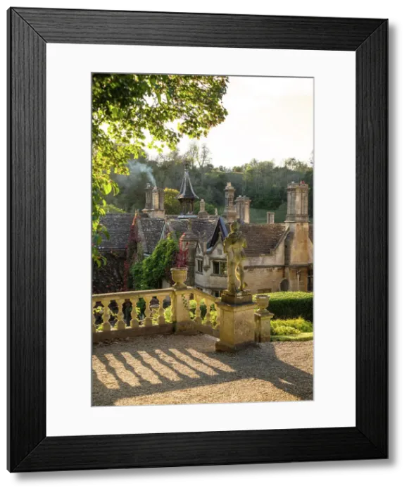 Framed Print : Evening light on The Manor House, 14th century building set in 365 acres of secluded parkland in the Cotswold village Castle Combe, Wiltshire, Cotswolds, England Framed Print : Evening light on The Manor House, 14th century building set in 365 acres of secluded parkland in the Cotswold village Castle Combe, Wiltshire, Cotswolds, England