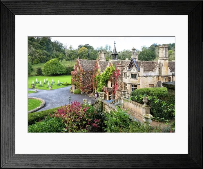 Framed Print : The Manor House, 14th century building set in 365 acres of secluded parkland in the Cotswold village Castle Combe, Wiltshire, Cotswolds, England Framed Print : The Manor House, 14th century building set in 365 acres of secluded parkland in the Cotswold village Castle Combe, Wiltshire, Cotswolds, England