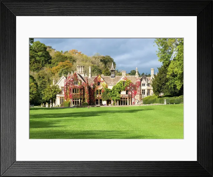 Framed Print : View towards The Manor House, 14th century building set in 365 acres of secluded parkland in the Cotswold village Castle Combe, Wiltshire, Cotswolds, England Framed Print : View towards The Manor House, 14th century building set in 365 acres of secluded parkland in the Cotswold village Castle Combe, Wiltshire, Cotswolds, England