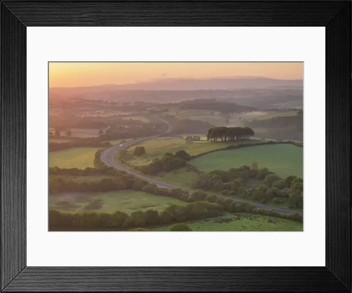 Framed Print : Dawn over the Nearly Home Trees, otherwise known as Cookworthy Knapp, and the A30 road to Cornwall, Lifton, Devon, England. Spring (May) 2023 Framed Print : Dawn over the Nearly Home Trees, otherwise known as Cookworthy Knapp, and the A30 road to Cornwall, Lifton, Devon, England. Spring (May) 2023