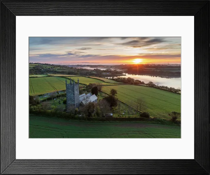 Framed Print : Aerial view of sunrise over the Church of St Laudus in the parish of Mabe near Falmouth, Cornwall, England. Spring (May) 2023 Framed Print : Aerial view of sunrise over the Church of St Laudus in the parish of Mabe near Falmouth, Cornwall, England. Spring (May) 2023