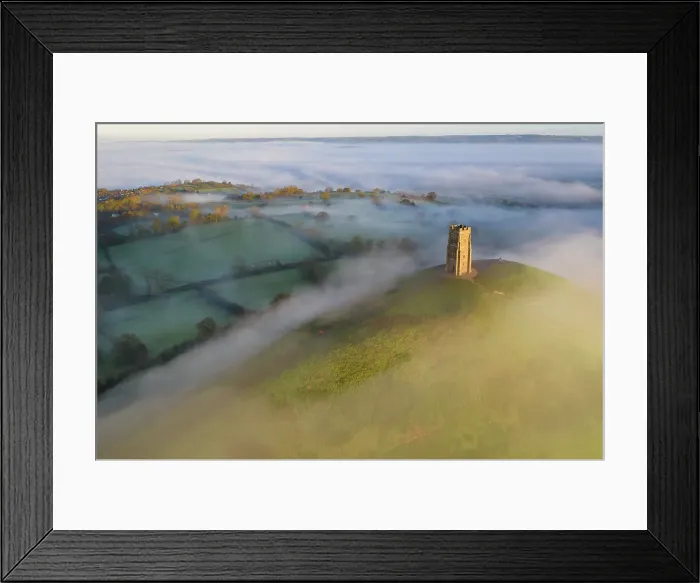 Framed Print : Aerial view of Glastonbury Tor surrounded by morning mist, Glastonbury, Somerset, England. Autumn (November) 2022 Framed Print : Aerial view of Glastonbury Tor surrounded by morning mist, Glastonbury, Somerset, England. Autumn (November) 2022